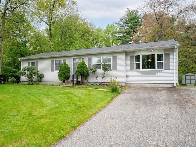 215 Pine Acre Rd, Springfield, MA 01129 - single story home with a shed, a front yard, an outbuilding, driveway, and entry steps