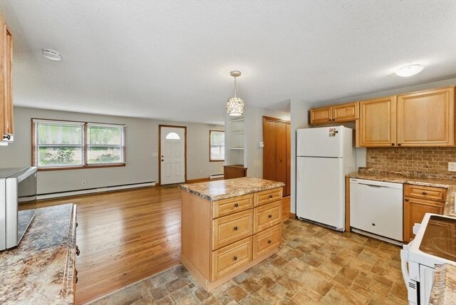 215 Pine Acre Rd, Springfield, MA 01129 - kitchen with white appliances, baseboard heating, a center island, decorative backsplash, and light brown cabinetry