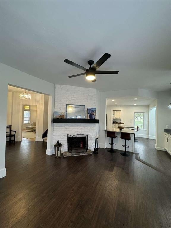 473 Massasoit Rd, Worcester, MA 01604 - living area featuring a wealth of natural light, wood finished floors, baseboards, and a stone fireplace