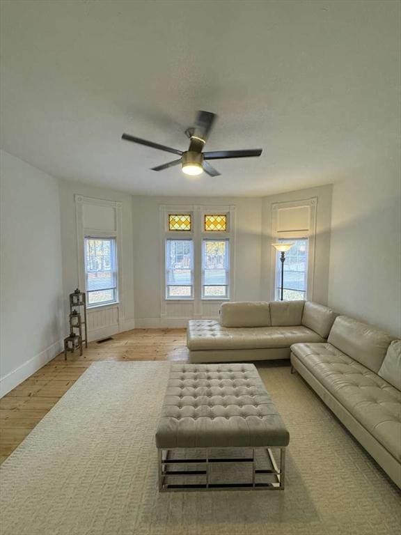 473 Massasoit Rd, Worcester, MA 01604 - living room featuring baseboards, a ceiling fan, and wood finished floors