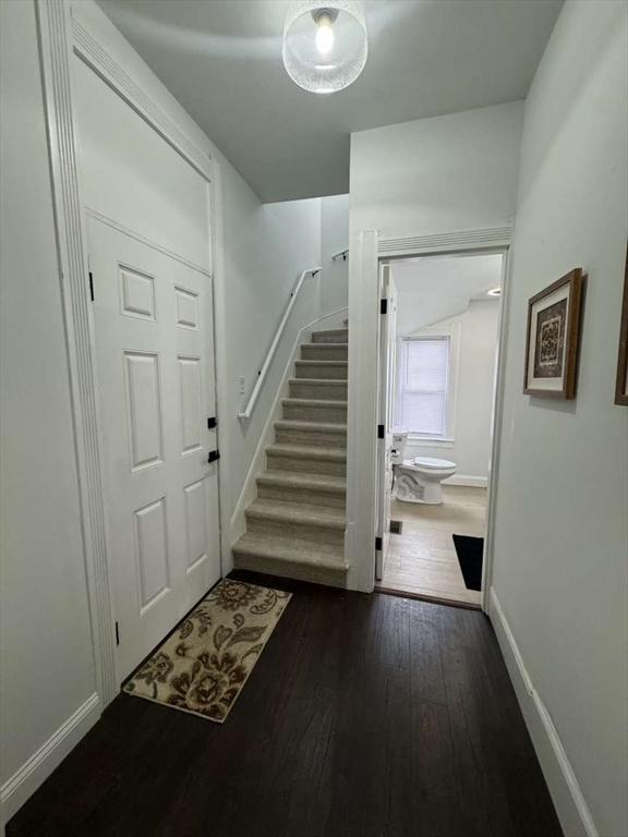 473 Massasoit Rd, Worcester, MA 01604 - entryway with baseboards, stairway, and dark wood finished floors