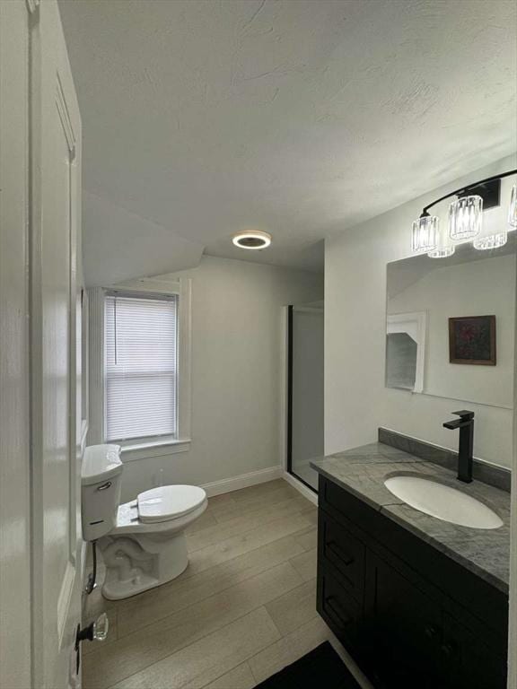 473 Massasoit Rd, Worcester, MA 01604 - full bath featuring toilet, wood finished floors, vanity, and a textured ceiling