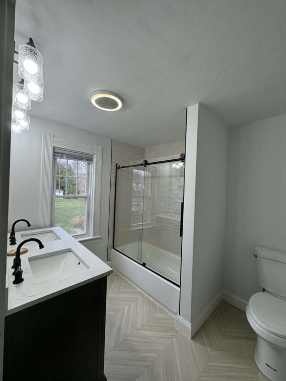 bathroom with vanity, toilet, and walk in shower