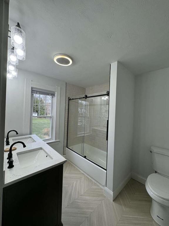 473 Massasoit Rd, Worcester, MA 01604 - bathroom featuring a shower with door, toilet, baseboards, and vanity