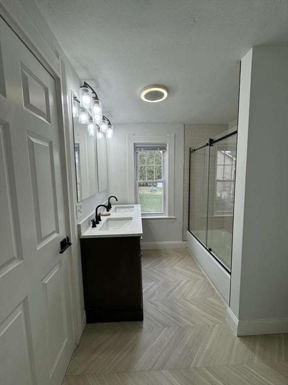 473 Massasoit Rd, Worcester, MA 01604 - full bath featuring baseboards, vanity, and enclosed tub / shower combo
