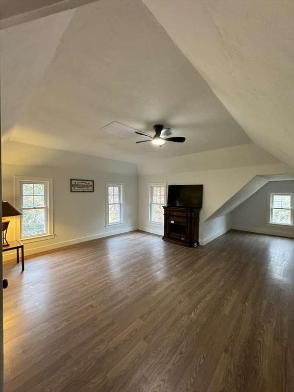 473 Massasoit Rd, Worcester, MA 01604 - unfurnished living room with ceiling fan, baseboards, dark wood-style floors, and plenty of natural light