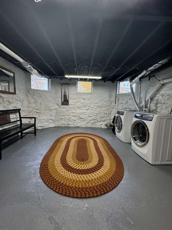 interior space with plenty of natural light and washing machine and clothes dryer