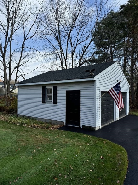 garage with a lawn