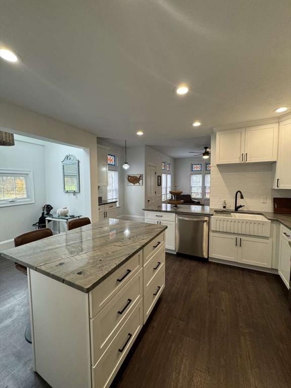 473 Massasoit Rd, Worcester, MA 01604 - kitchen featuring a peninsula, a sink, white cabinetry, dark wood-style flooring, and dishwasher