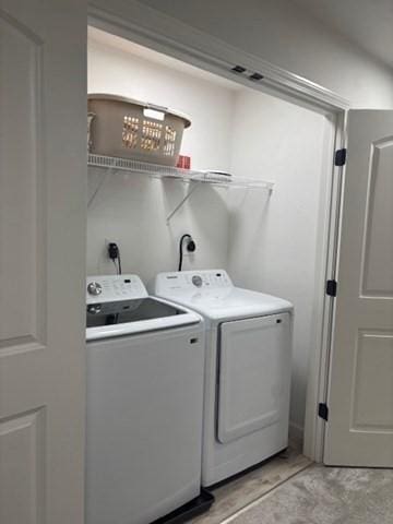 laundry room with washer and dryer and laundry area