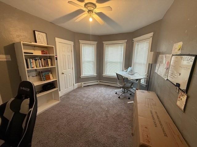 office area featuring a baseboard heating unit, carpet floors, and ceiling fan