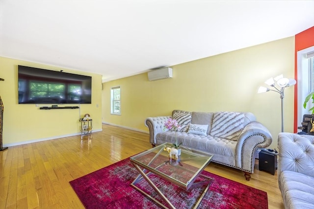68 Ice Pond Dr, Northampton, MA 01062 - living room featuring a wall mounted AC, wood finished floors, and baseboards