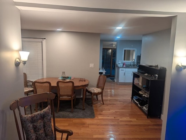 dining space featuring light wood finished floors