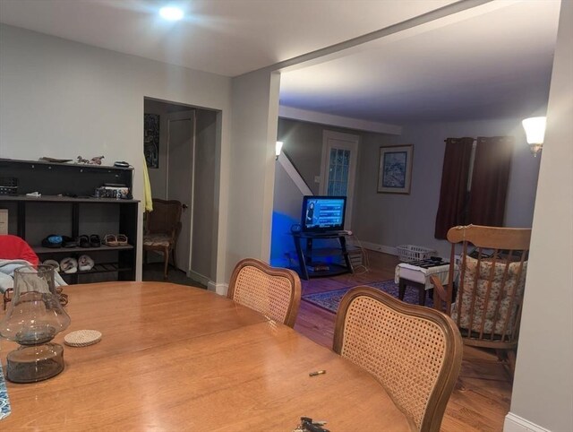 dining room featuring wood finished floors and baseboards
