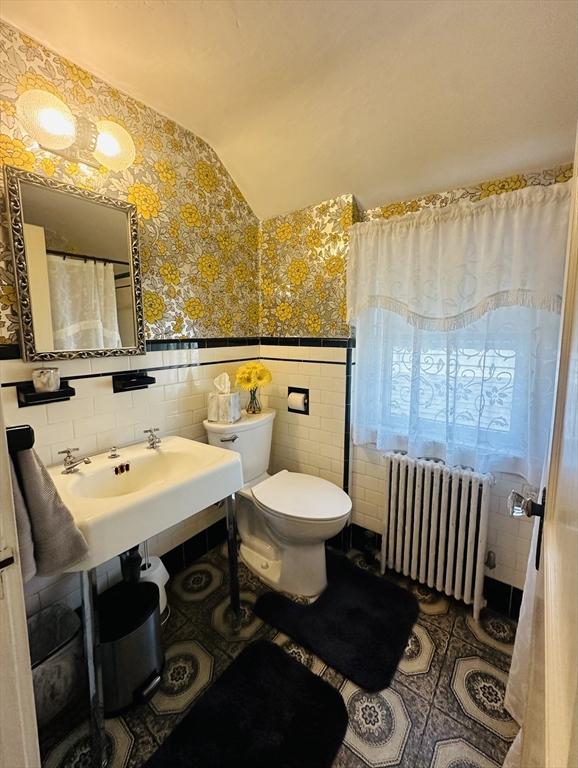 70 Sherman St, Quincy, MA 02170 - full bath with radiator, tile walls, wallpapered walls, toilet, and tile patterned floors