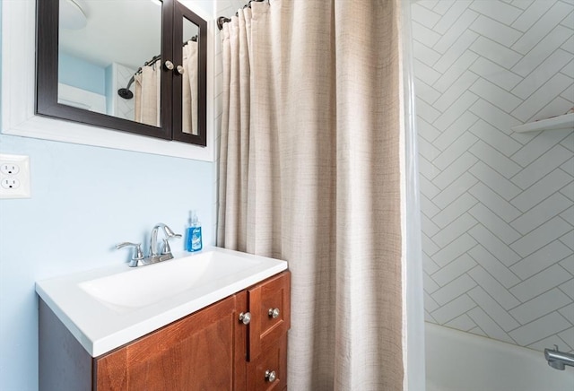 bathroom with shower / bath combination with curtain and vanity