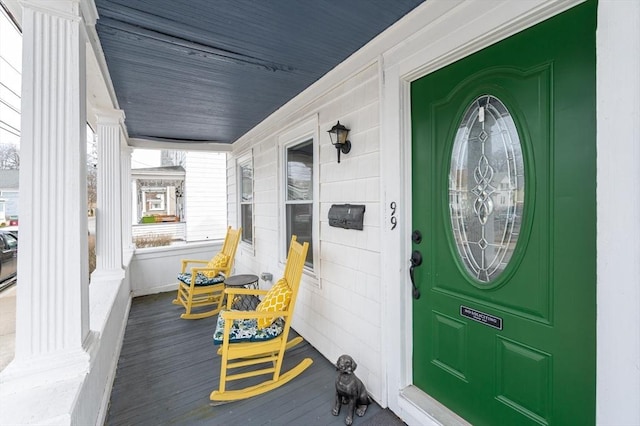 view of exterior entry with covered porch