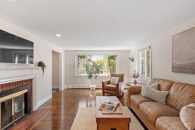 286 Laurel St, Melrose, MA 02176 - living area with a baseboard radiator, dark wood-style floors, a tile fireplace, baseboards, and recessed lighting