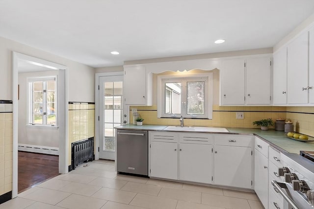 286 Laurel St, Melrose, MA 02176 - kitchen featuring stainless steel dishwasher, a baseboard heating unit, light countertops, white cabinets, and recessed lighting