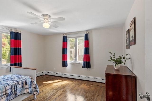 286 Laurel St, Melrose, MA 02176 - bedroom with baseboard heating, wood finished floors, and ceiling fan