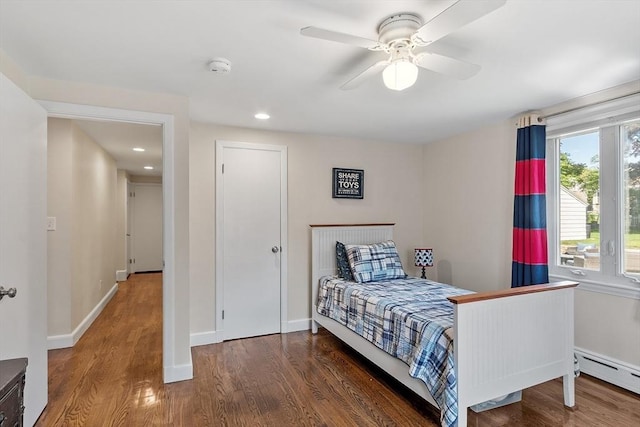286 Laurel St, Melrose, MA 02176 - bedroom with wood finished floors, baseboards, a baseboard heating unit, recessed lighting, and ceiling fan
