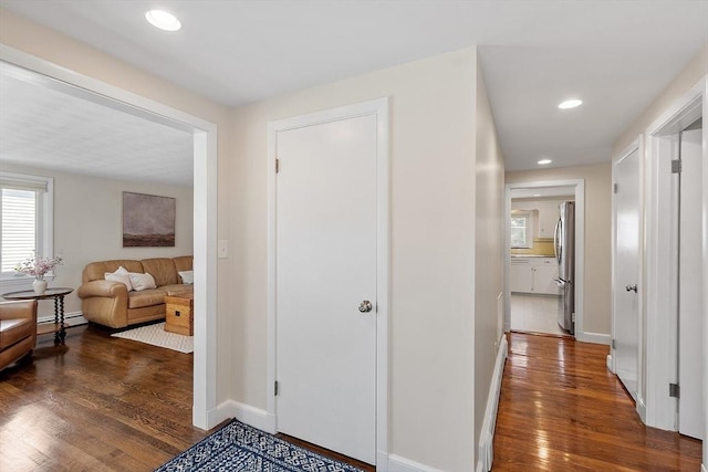 286 Laurel St, Melrose, MA 02176 - hall with wood finished floors, baseboards, recessed lighting, and baseboard heating