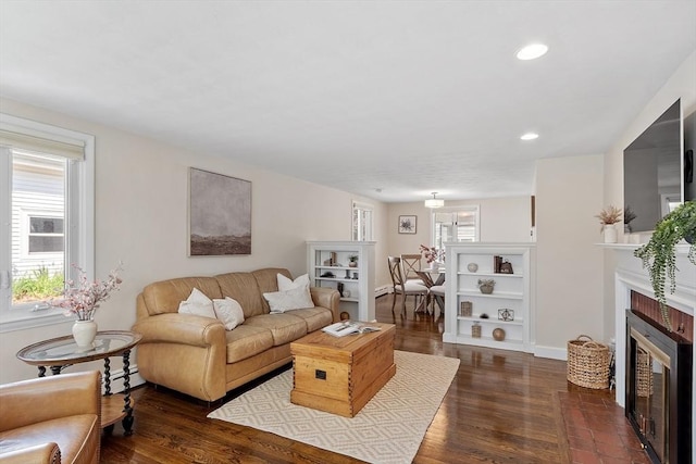 286 Laurel St, Melrose, MA 02176 - living area with healthy amount of natural light, a fireplace, dark wood finished floors, and recessed lighting
