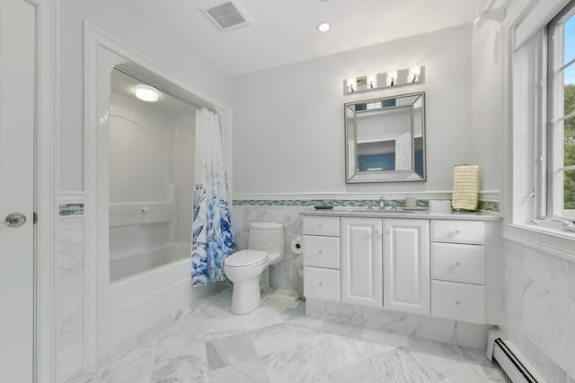 bathroom featuring baseboard heating, tile walls, toilet, and a healthy amount of sunlight