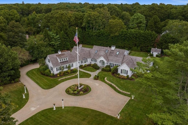 aerial view featuring a wooded view