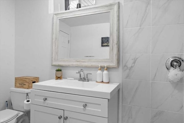 bathroom with vanity and toilet