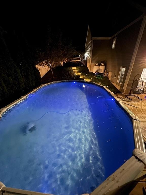 pool at twilight with an outdoor pool