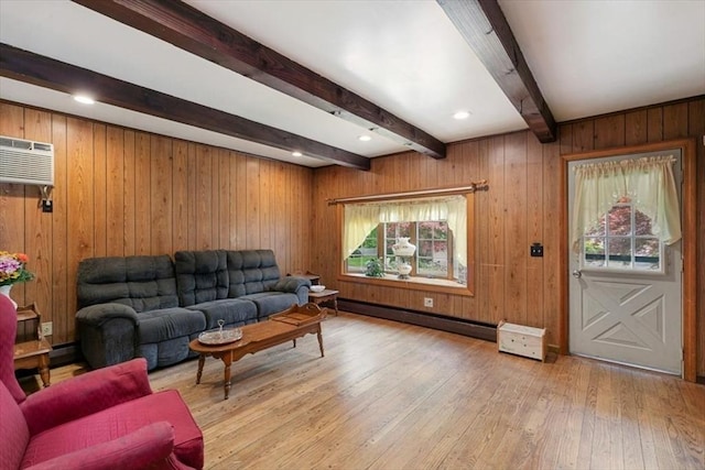 72 Heath St, Tewksbury, MA 01876 - living room with light wood finished floors, beamed ceiling, a baseboard radiator, a wall mounted AC, and wood walls