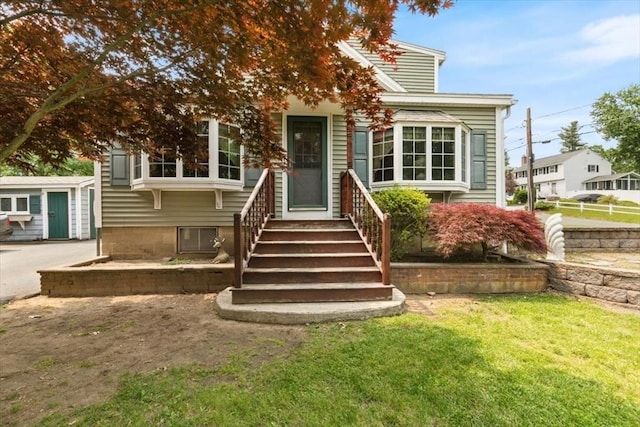72 Heath St, Tewksbury, MA 01876 - view of front of house with a front lawn