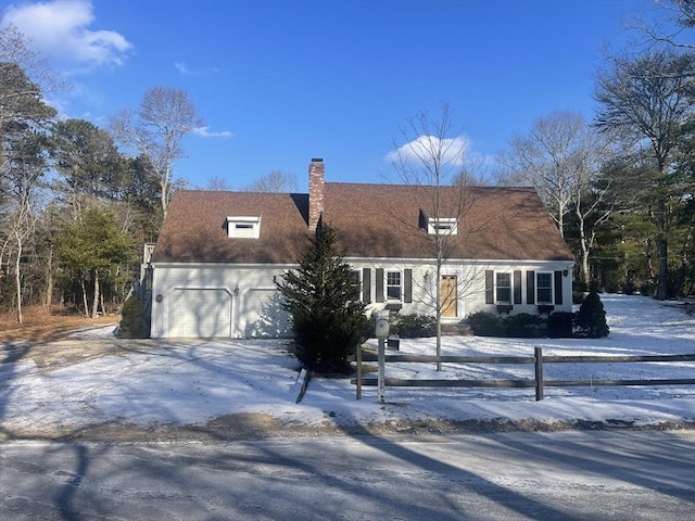 new england style home featuring a garage