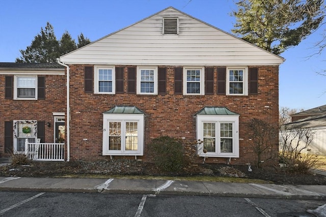 view of front of property featuring brick siding