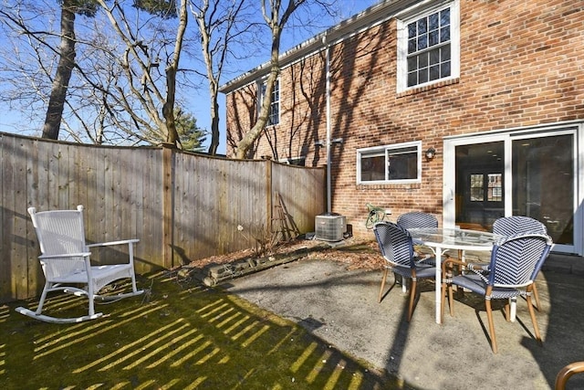 view of patio / terrace featuring central air condition unit and a fenced backyard