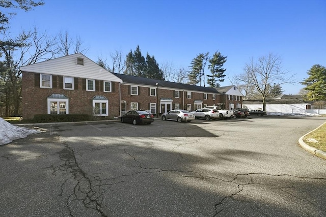 view of property featuring uncovered parking