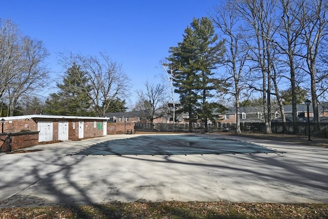 pool featuring a patio area and fence