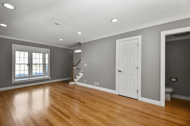 interior space with stairway, baseboards, light wood finished floors, recessed lighting, and crown molding