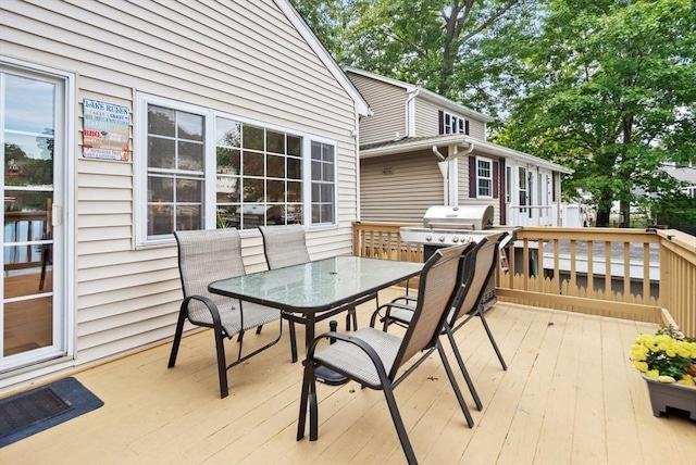 27 Lakeview St, Southwick, MA 01077 - wooden terrace with outdoor dining area