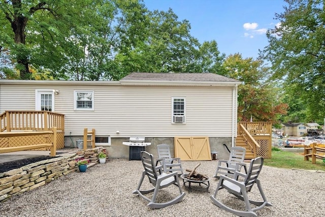 27 Lakeview St, Southwick, MA 01077 - rear view of property with a wooden deck, a fire pit, and stairway
