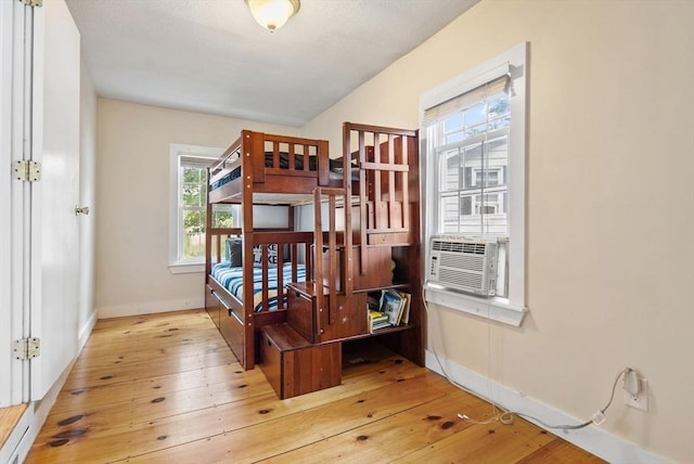 27 Lakeview St, Southwick, MA 01077 - bedroom with baseboards, hardwood / wood-style flooring, and cooling unit