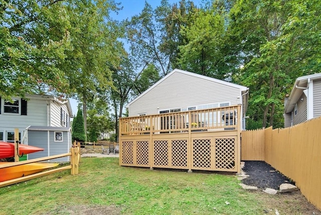 27 Lakeview St, Southwick, MA 01077 - back of property featuring a yard, a wooden deck, and a fenced backyard