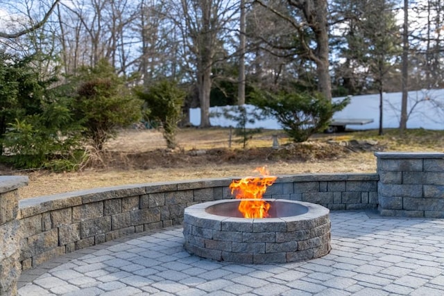 view of patio / terrace featuring an outdoor fire pit