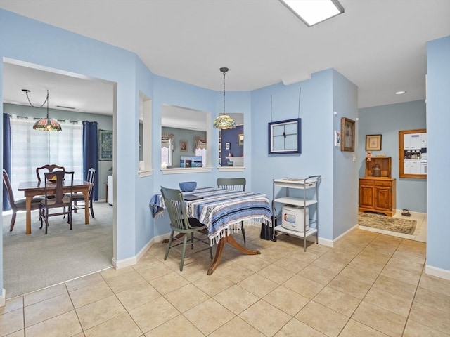 dining area with light tile patterned floors