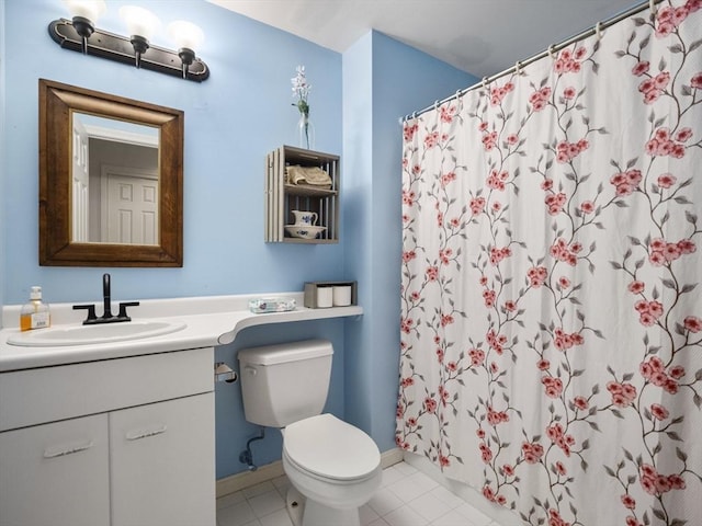 bathroom featuring vanity, toilet, tile patterned floors, and walk in shower