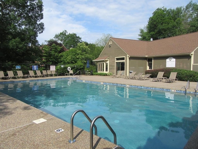 view of swimming pool with a patio