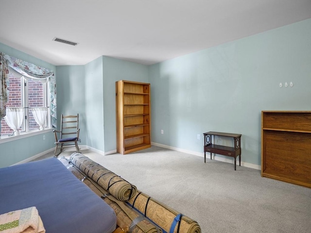 bedroom featuring light colored carpet