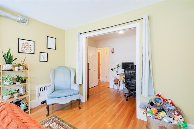 33 Saint Paul St Unit 3, Brookline, MA 02446 - living area with light wood-style floors and radiator