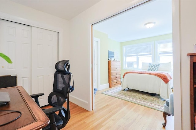 33 Saint Paul St Unit 3, Brookline, MA 02446 - bedroom with light wood-style flooring, a desk, and a closet